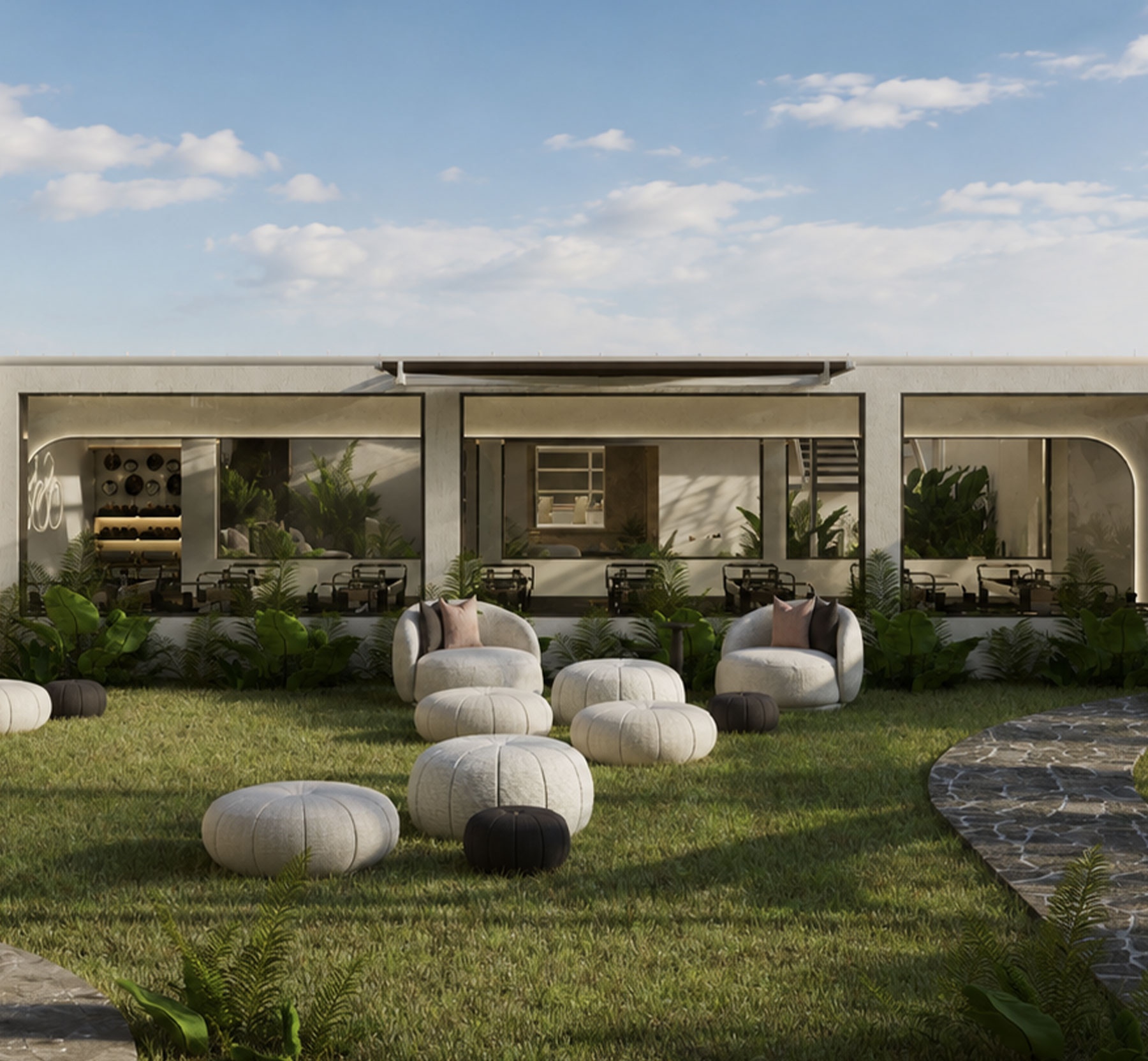 Terraza social de Huma con sillones y areas verdes.